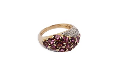 Lot 689 - A tourmaline and diamond bombe form dress ring