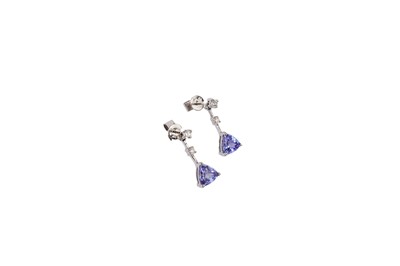 Lot 694 - A pair of tanzanite and diamond drop earrings