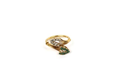 Lot 696 - An emerald and diamond dress ring