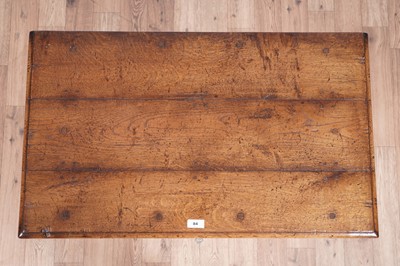 Lot 84 - Attributed to Theodore Alexander: a Georgian style oak side table