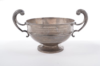 Lot 129 - An Edwardian large silver two handled trophy cup