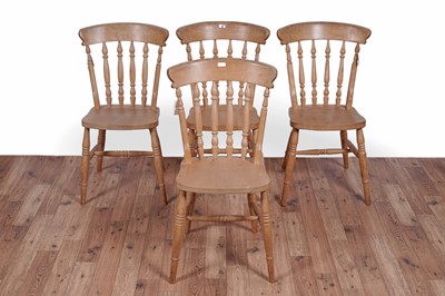 Lot 83 - A vintage pine table; and four beech chairs