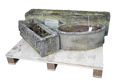 Lot 480 - Two rectangular stone garden trough planters with carved figural decoration; and another