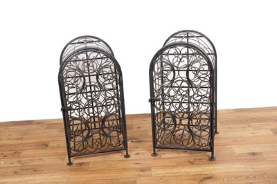 Lot 84 - A pair of cast metal wine racks