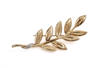 Lot 778 - A diamond and yellow gold leaf sprig brooch