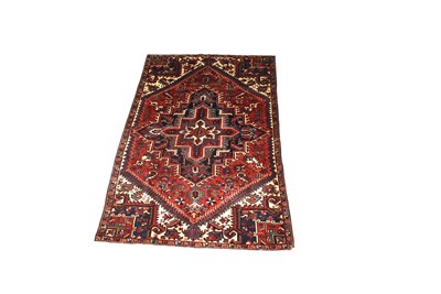 Lot 1221 - A Persian hand-made Heriz carpet