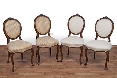 Lot 26 - A set of four Victorian carved walnut salon chairs