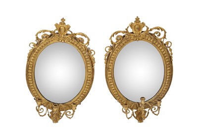 Lot 1401 - A pair of George III giltwood girandole mirrors