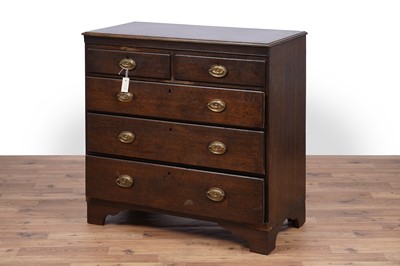 Lot 144 - A George III oak chest of drawers