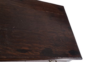 Lot 65 - A George III oak kneehole desk