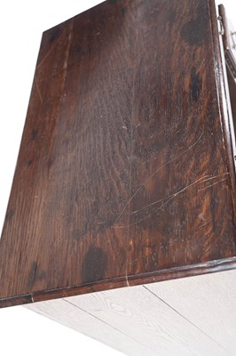 Lot 65 - A George III oak kneehole desk