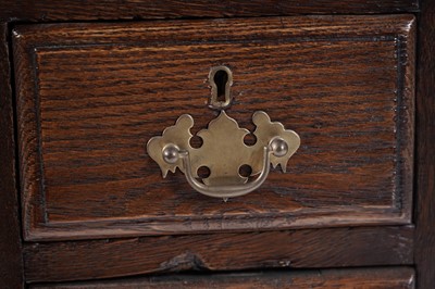 Lot 65 - A George III oak kneehole desk