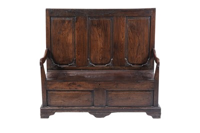 Lot 1476 - A George III oak box settle