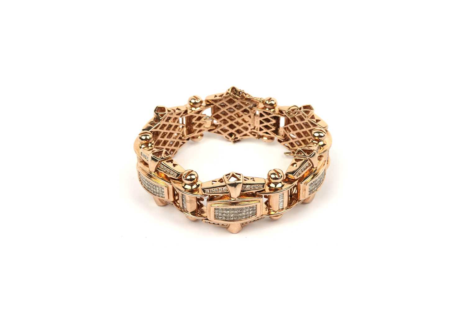 Lot 813 - A diamond and gold bracelet