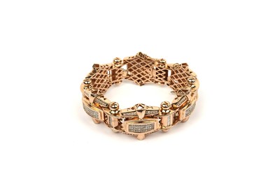 Lot 813 - A diamond and gold bracelet