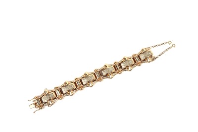 Lot 813 - A diamond and gold bracelet