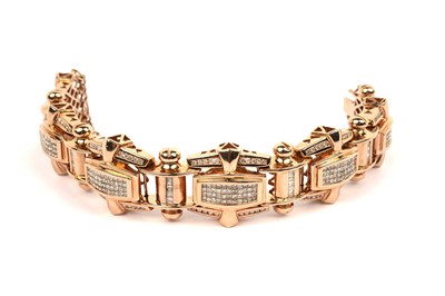 Lot 813 - A diamond and gold bracelet