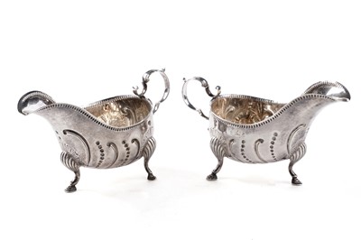 Lot 92 - A pair of Edwardian Irish silver sauceboats