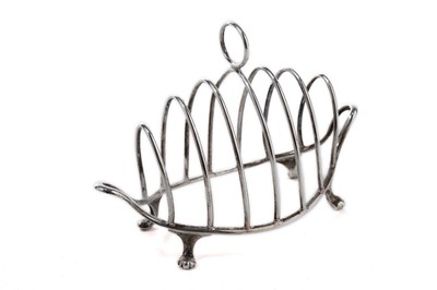 Lot 1025 - A Victorian silver seven bar toast rack by Henry Wilkinson & Co