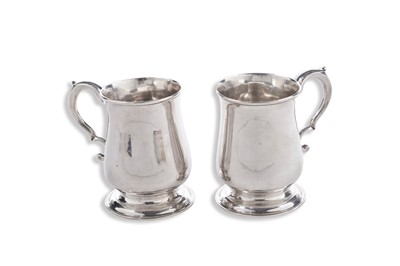 Lot 75 - A pair of George II silver North Country mugs