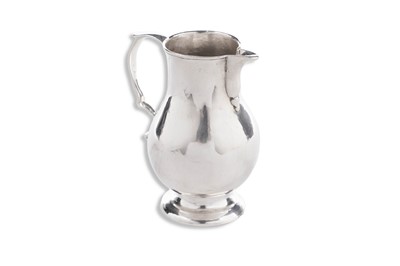 Lot 79 - A George III provincial silver sparrow-beak cream jug