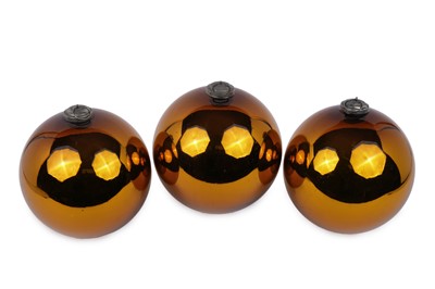 Lot 84 - Three vintage witches balls, ﻿in an orange mirrored finish