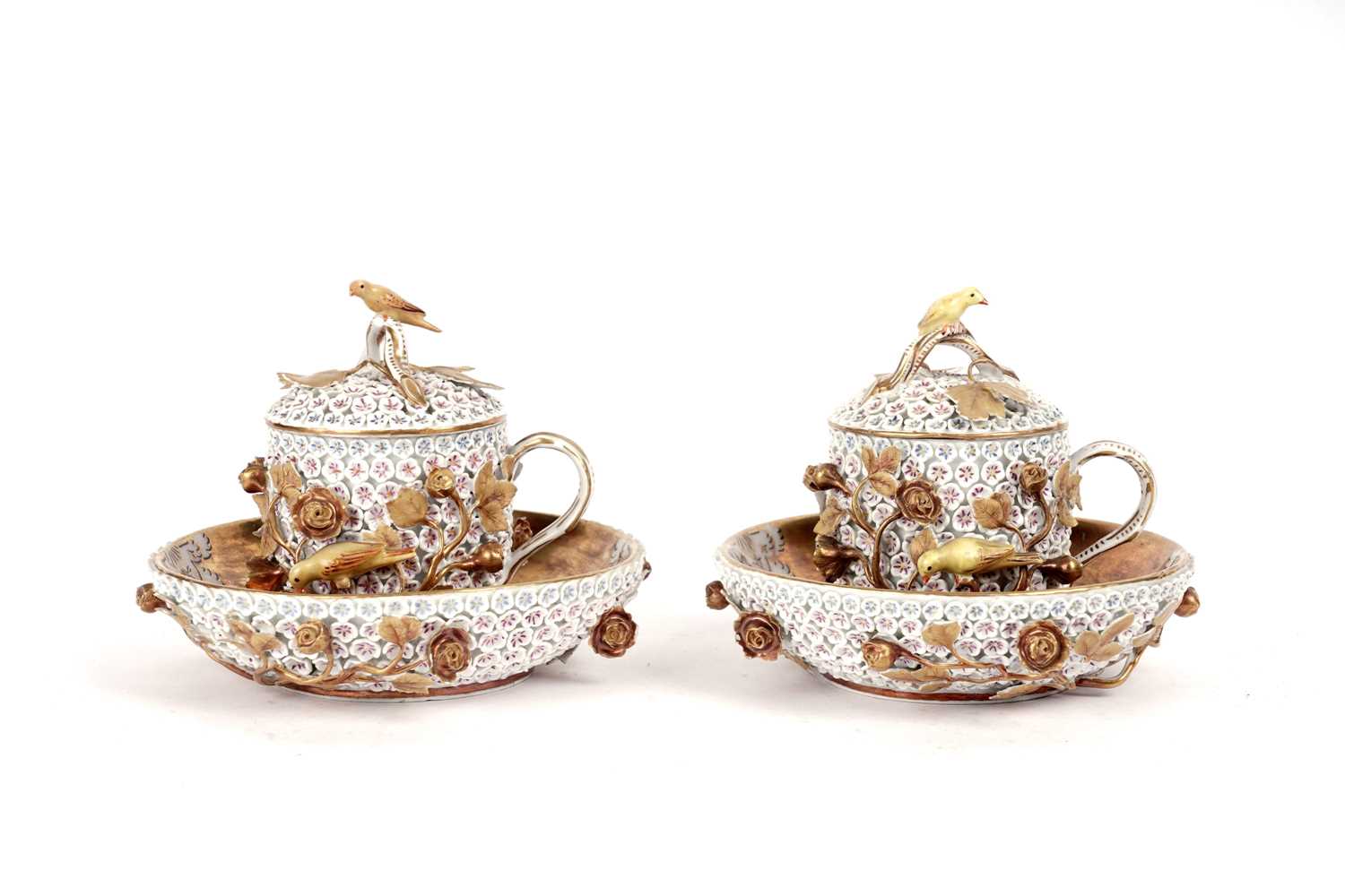 Lot 1008 - A pair of Meissen 'Schneeballen' covered cups and saucers