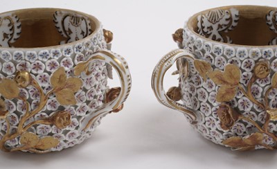 Lot 1008 - A pair of Meissen 'Schneeballen' covered cups and saucers