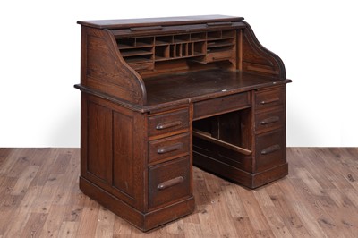 Lot 113 - An early 20th century oak rolltop desk; and a 20th Century oak bookcase