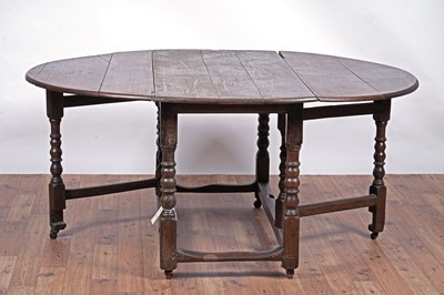 Lot 104 - An 18th Century oak drop-leaf dining table; and other items