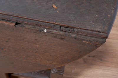 Lot 104 - An 18th Century oak drop-leaf dining table; and other items