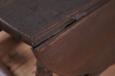 Lot 104 - An 18th Century oak drop-leaf dining table; and other items