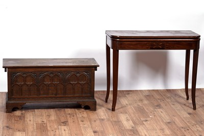 Lot 107 - A Georgian style carved oak coffer; and a late Georgian inlaid mahogany tea table