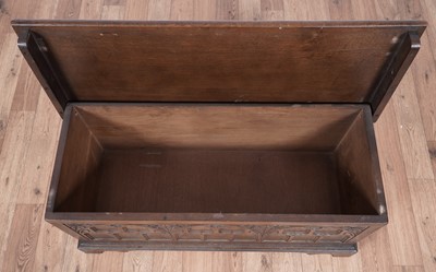 Lot 107 - A Georgian style carved oak coffer; and a late Georgian inlaid mahogany tea table