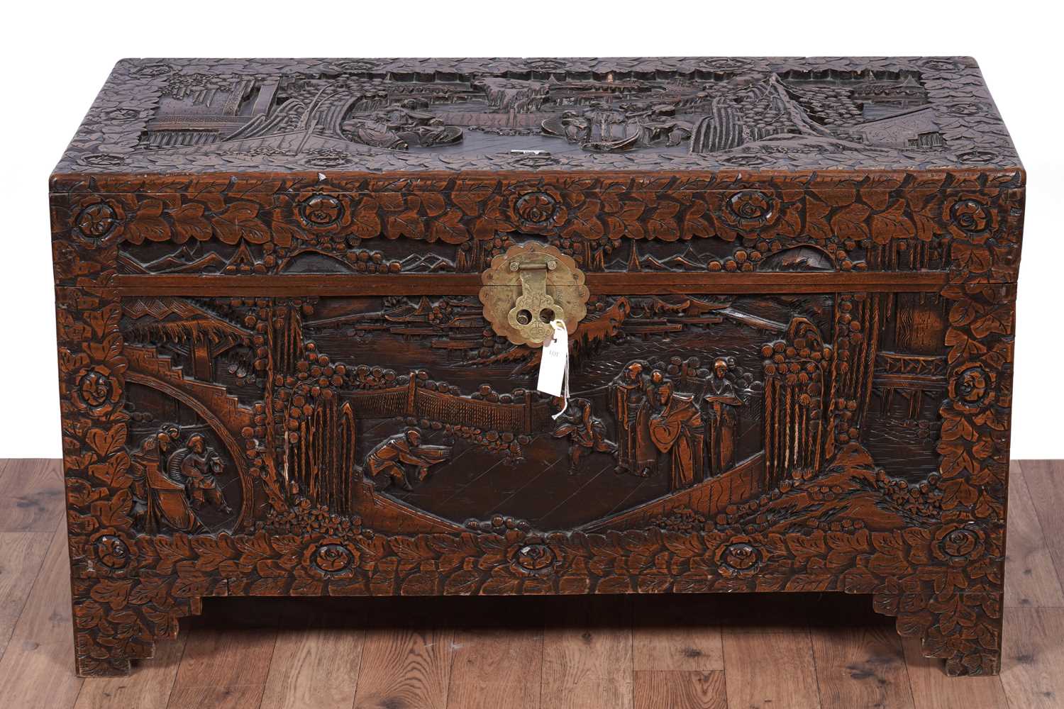 Lot 103 - A 20th Century Oriental carved camphor wood blanket box