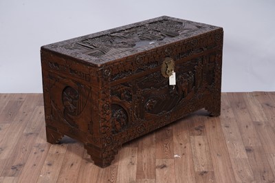 Lot 103 - A 20th Century Oriental carved camphor wood blanket box