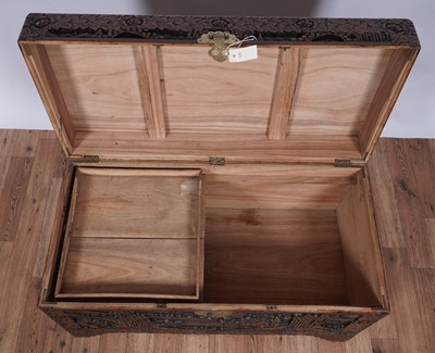 Lot 103 - A 20th Century Oriental carved camphor wood blanket box