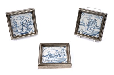 Lot 465 - A set of three framed Delft blue and white tiles