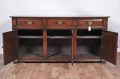 Lot 115 - Titchmarsh and Goodwin: a Georgian style oak sideboard