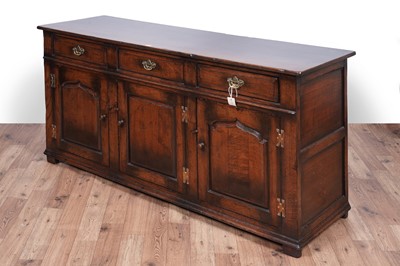 Lot 115 - Titchmarsh and Goodwin: a Georgian style oak sideboard