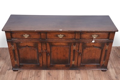 Lot 115 - Titchmarsh and Goodwin: a Georgian style oak sideboard