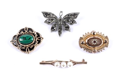 Lot 930 - A Victorian mourning brooch; and three other brooches