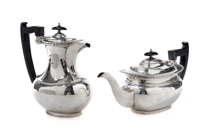 Lot 964 - A George V silver teapot and hot water pot