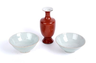 Lot 876 - A pair of celadon rice bowls; and a Chinese iron-red monochrome vase