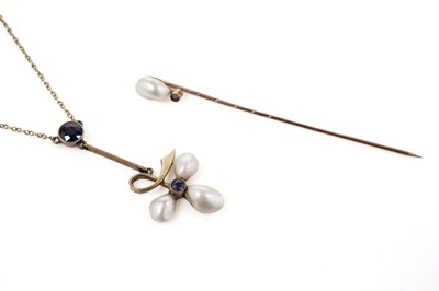 Lot 89 - An Edwardian baroque pearl and sapphire drop pendant and a similar stick pin