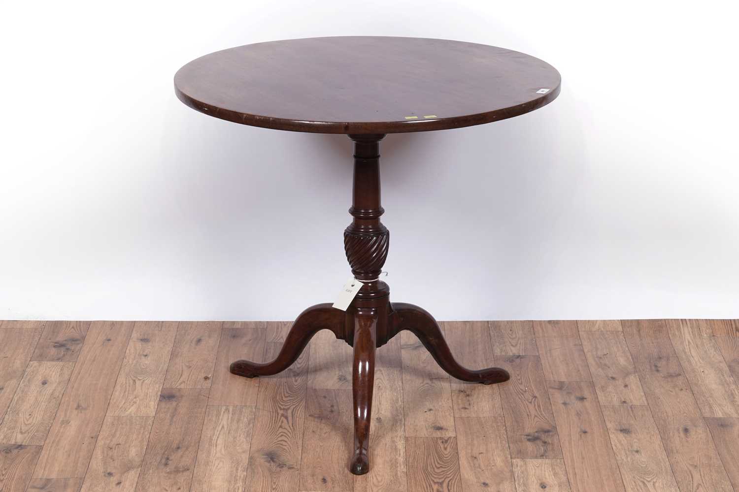 Lot 99 - A 19th Century mahogany tripod table