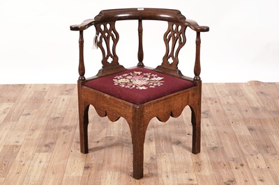 Lot 426 - A George III oak Chippendale style corner chair