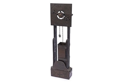 Lot 209 - A 20th Century oak and brass wall hanging water clock