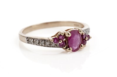 Lot 611 - A ruby and diamond dress ring