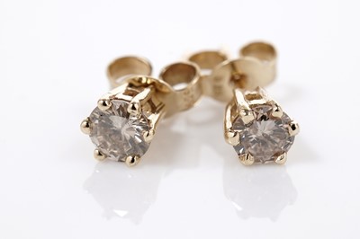 Lot 621 - A pair of diamond stud earrings